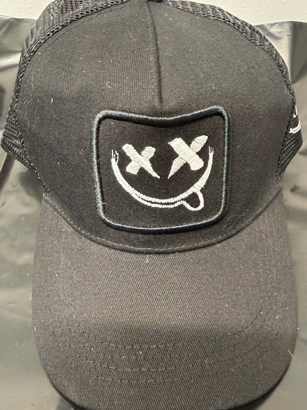 Black Trucker Cap with Smiley Patch